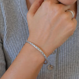 Silver Hammered Bangle with Floral Pattern