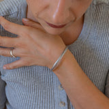 Silver Hammered Bangle with Floral Pattern