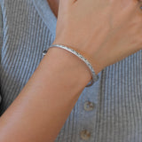 Silver Hammered Bangle with Floral Pattern