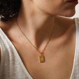 Χρυσό ορθογώνιο κολιέ με μενταγιόν ήλιου