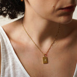 Χρυσό ορθογώνιο κολιέ με μενταγιόν ήλιου