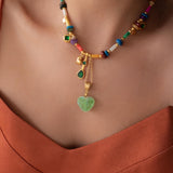 Χρυσό Κολιέ με Κοχύλια και Πράσινη Καρδιά